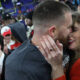 Travis Kelce #87 of the Kansas City Chiefs embraces Taylor Swift