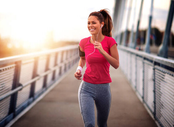 Young woman jogging outdoors on bridge. for healthy lifestyle.