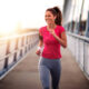 Young woman jogging outdoors on bridge. for healthy lifestyle.