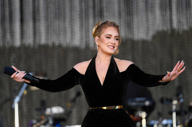 Adele performs on stage as American Express 