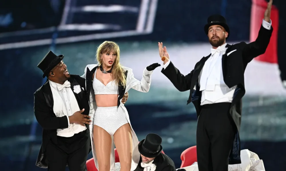 Dancer Kameron Saunders, Taylor Swift and Travis Kelce perform at the Eras Tour in London on Sunday
