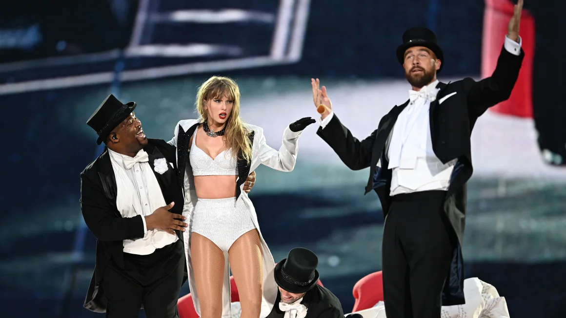 Dancer Kameron Saunders, Taylor Swift and Travis Kelce perform at the Eras Tour in London on Sunday