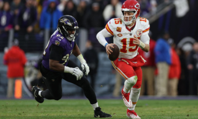 BALTIMORE, MARYLAND - JANUARY 28: Patrick Mahomes #15 of the Kansas City Chiefs rushes with the ball against the Baltimore Ravens in the AFC Championship Game at M&T Bank Stadium on January 28, 2024 in Baltimore, Maryland.