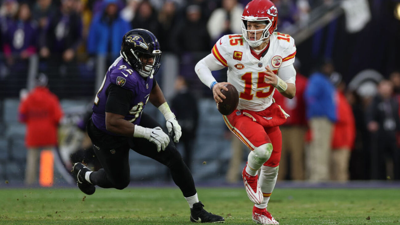 BALTIMORE, MARYLAND - JANUARY 28: Patrick Mahomes #15 of the Kansas City Chiefs rushes with the ball against the Baltimore Ravens in the AFC Championship Game at M&T Bank Stadium on January 28, 2024 in Baltimore, Maryland.