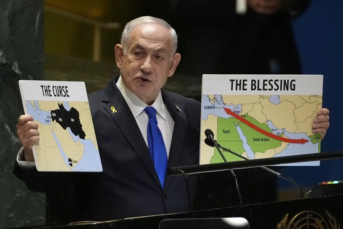 Prime Minister of Israel Benjamin Netanyahu hold signs as he addresses the 79th session of the United Nations General Assembly on Friday.