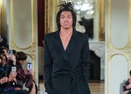 Henry Samuel, Heidi Klum’s son, makes his runway debut at Paris Haute Couture Fashion Week, opening the Lena Erziak show in a sleek black pantsuit.